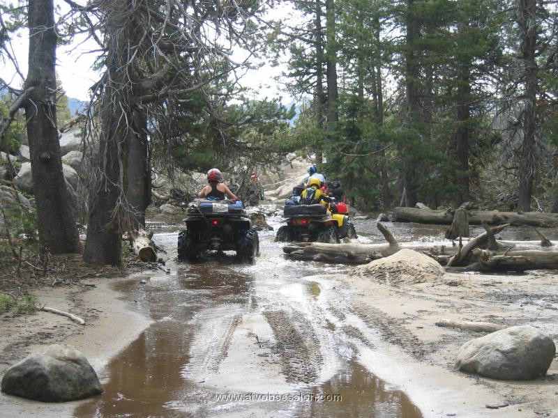 033. Miren and Larry cross a small run-off creek..jpg