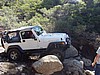 123. The Rubicon goes over the two boulders..jpg
