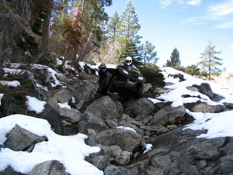 050. Terry shoots Ken giving Dusty a push in the boulder field down to the river..jpg
